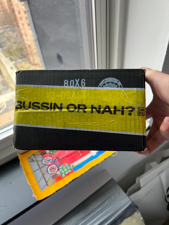 Custom yellow Bussin or Nah tape on the limited-edition immi × Lynja shipping box